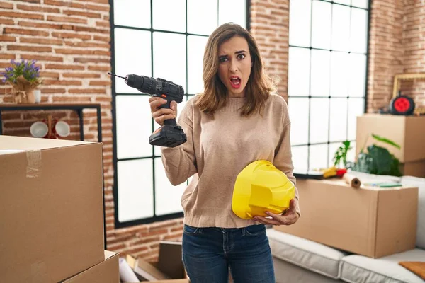 Young Woman Holding Drill New Home Clueless Confused Expression Doubt — Stockfoto