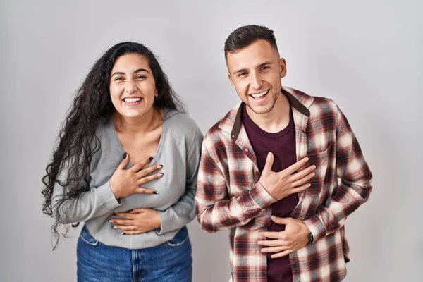Young Hispanic Couple Standing White Background Smiling Laughing Hard Out — Stockfoto