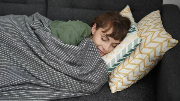Young Caucasian Woman Sleeping Sofa Covered Blanket Home — Foto de Stock