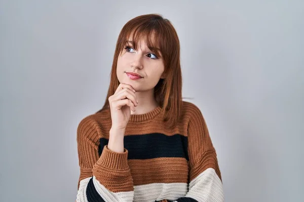 Young Beautiful Woman Wearing Striped Sweater Isolated Background Hand Chin — Fotografia de Stock