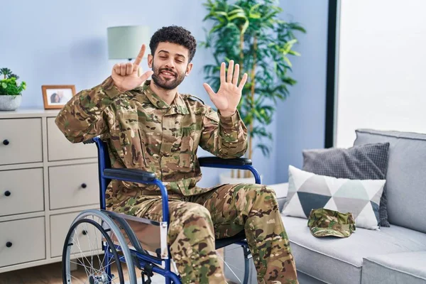 Arab Man Wearing Camouflage Army Uniform Sitting Wheelchair Showing Pointing — Stock Photo, Image