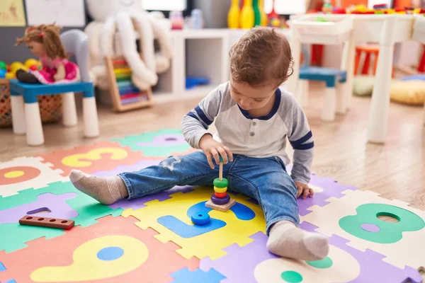 Adorable Caucasian Boy Playing Hoops Toy Sitting Floor Kindergarten — Stock Photo, Image