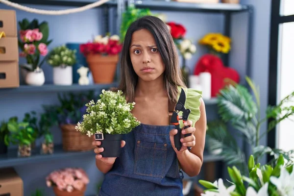 Hispanic Young Woman Working Florist Shop Skeptic Nervous Frowning Upset — Stockfoto