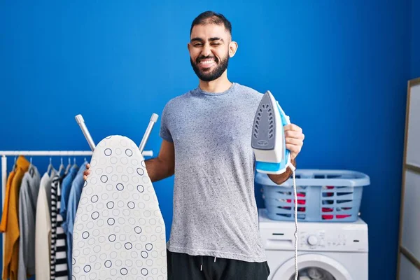 Middle East Man Beard Holding Electric Iron Winking Looking Camera — Stockfoto