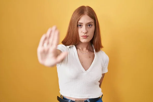 Young Redhead Woman Standing Yellow Background Doing Stop Sing Palm — Stock Photo, Image