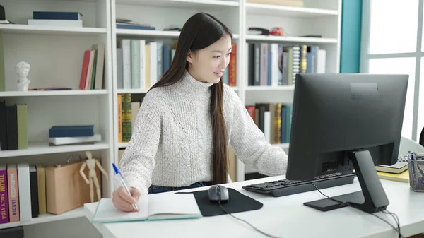 Young Chinese Woman Student Using Computer Writing Notebook Library University — Stock fotografie