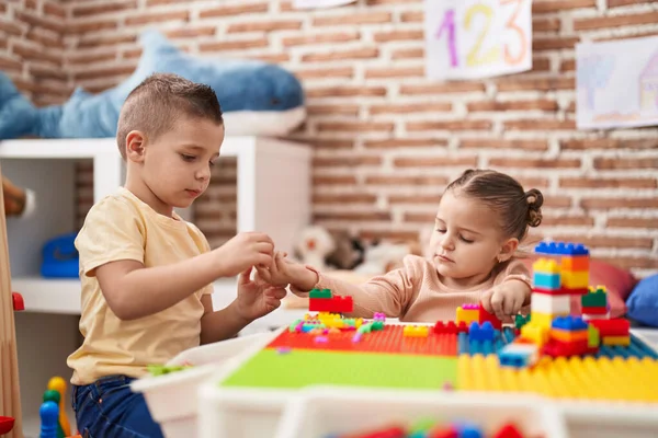 Two Kids Playing Construction Blocks Sitting Table Kindergarten Stok Resim