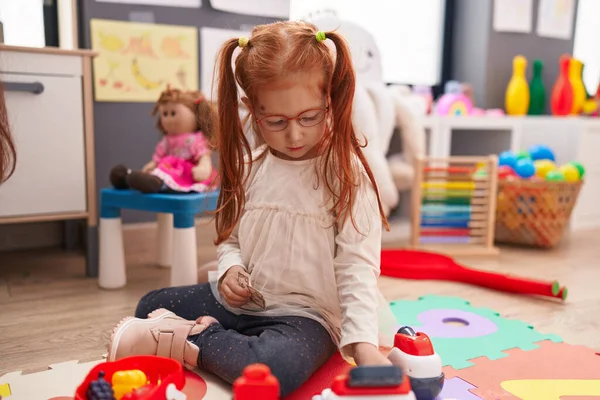 Adorable Redhead Girl Playing Money Game Sitting Floor Kindergarten — Foto Stock