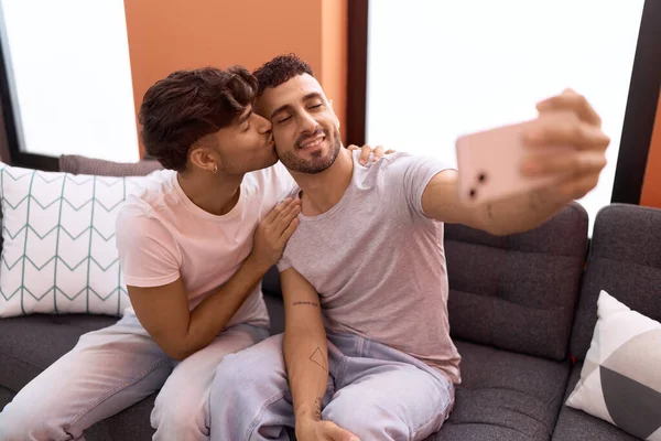 Two Hispanic Men Couple Make Selfie Smartphone Kissing Home —  Fotos de Stock