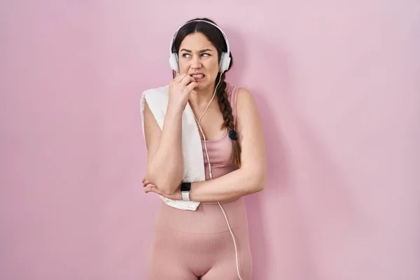 Young Brunette Woman Wearing Sportswear Headphones Looking Stressed Nervous Hands — Photo
