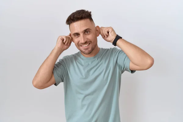 Hispanic Man Beard Standing White Background Smiling Pulling Ears Fingers — Stock fotografie