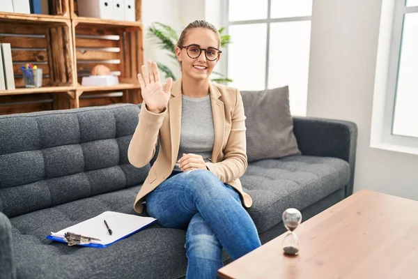 Young Woman Working Consultation Office Waiving Saying Hello Happy Smiling — Stockfoto
