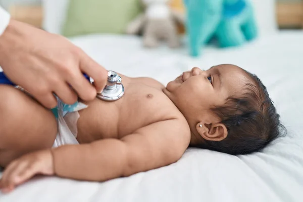 African American Baby Having Medical Examination Lying Bed Bedroom — ストック写真