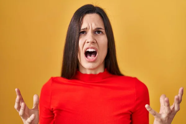 Young Hispanic Woman Standing Yellow Background Crazy Mad Shouting Yelling — Stok fotoğraf