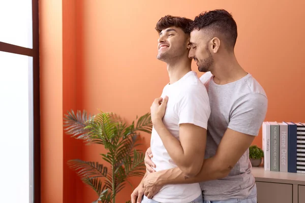 Two Hispanic Men Couple Hugging Each Other Standing Home —  Fotos de Stock