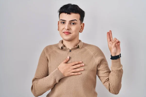 Non Binary Person Standing Isolated Background Smiling Swearing Hand Chest — Stok fotoğraf