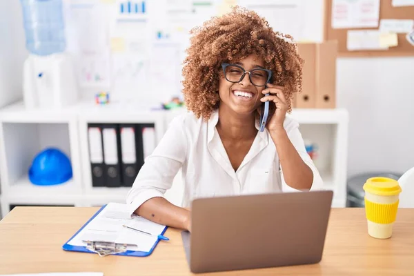 African American Woman Business Worker Using Laptop Talking Smartphone Office — Stock Photo, Image