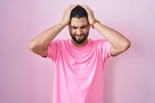Hispanic Young Man Standing Pink Background Suffering Headache Desperate Stressed — Stockfoto