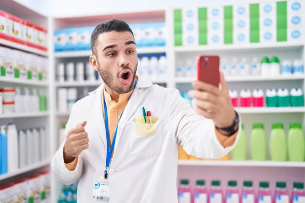 Young Hispanic Man Working Pharmacy Drugstore Doing Video Call Smartphone — Stockfoto