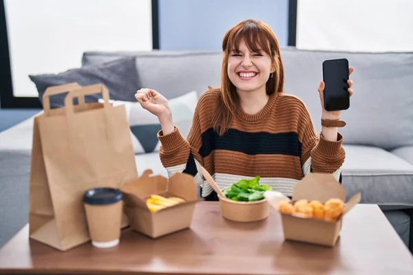 Young Beautiful Woman Eating Delivery Food Living Room Screaming Proud — Stockfoto