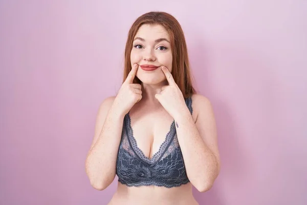 Redhead Woman Wearing Lingerie Pink Background Smiling Open Mouth Fingers — 스톡 사진