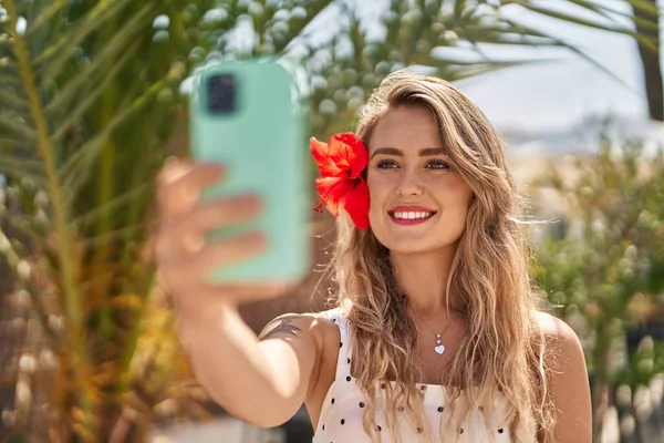 Young woman smiling confident make selfie by smartphone at park