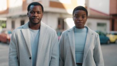 African american couple smiling confident standing with arms crossed gesture at street