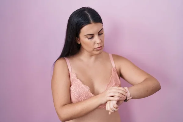 Young Hispanic Woman Wearing Pink Bra Checking Time Wrist Watch — Stock Photo, Image