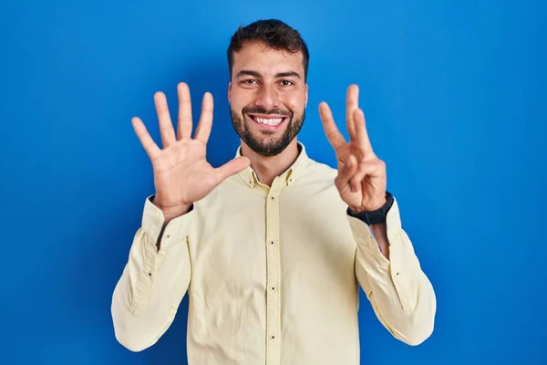 Handsome Hispanic Man Standing Blue Background Showing Pointing Fingers Number — Fotografia de Stock