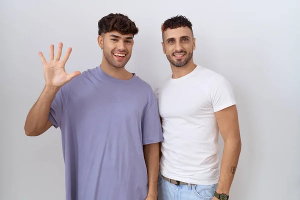 Homosexual Gay Couple Standing White Background Showing Pointing Fingers Number — Stock Fotó