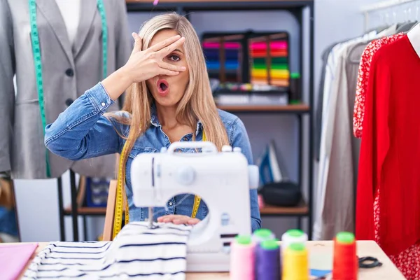 Blonde Woman Dressmaker Designer Using Sew Machine Peeking Shock Covering — Foto de Stock