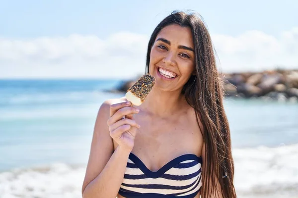 Young Hispanic Woman Wearing Bikini Eating Ice Cream Seaside — Foto de Stock