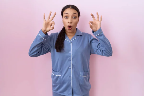 Young Arab Woman Wearing Blue Pajama Looking Surprised Shocked Doing — Zdjęcie stockowe