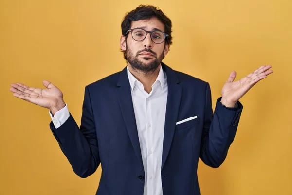 Handsome Latin Man Standing Yellow Background Clueless Confused Expression Arms — Stock Photo, Image