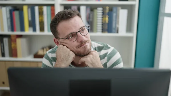 Young Caucasian Man Using Computer Thinking Library University — Foto Stock