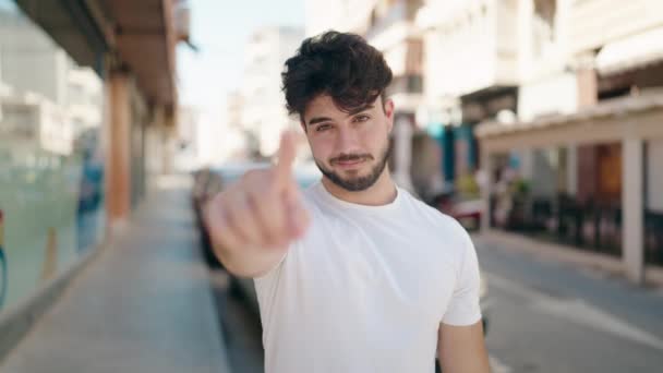 Young Hispanic Man Smiling Confident Doing Coming Gesture Finger Street — Stock Video
