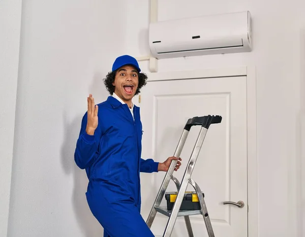 Hispanic Man Curly Hair Working Home Renovation Celebrating Victory Happy — Fotografia de Stock