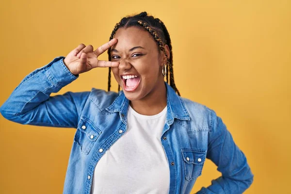 African American Woman Braids Standing Yellow Background Doing Peace Symbol — Stockfoto