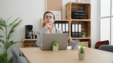 Middle age woman business worker working at office