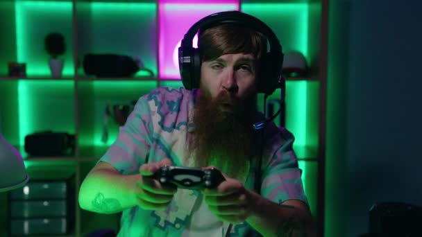 Young Redhead Man Streamer Playing Video Game Using Joystick Gaming — Stock Video