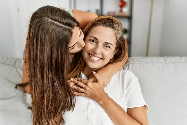 Mother Daughter Kissing Hugging Each Other Sitting Sofa Home — Foto Stock