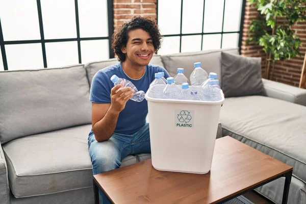 Hispanic Man Curly Hair Holding Recycling Bin Plastic Bottles Home — Fotografia de Stock