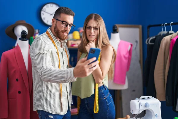 Man Woman Tailors Smiling Confident Using Smartphone Clothing Factory — Stockfoto
