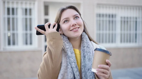 Young Blonde Woman Listening Audio Message Smartphone Drinking Coffee Street — Fotografia de Stock