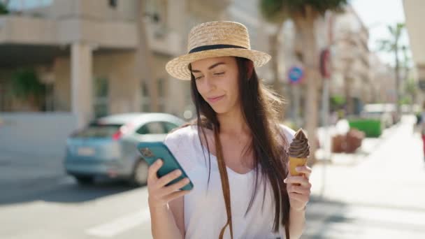 Young Hispanic Woman Tourist Using Smartphone Eating Ice Cream Street — Wideo stockowe