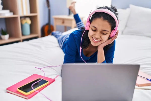 Young Latin Woman Listening Music Lying Bed Bedroom — Stockfoto