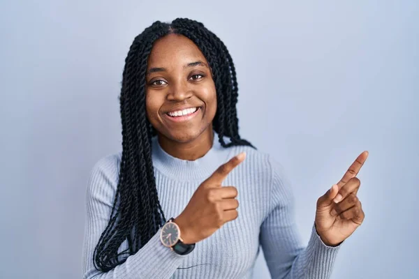 African American Woman Standing Blue Background Smiling Looking Camera Pointing — Foto Stock