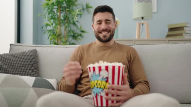 Young Hispanic Man Watching Movie Sitting Sofa Home — Vídeos de Stock