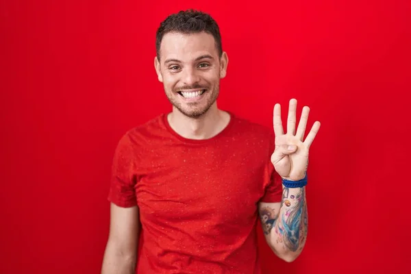 Young Hispanic Man Standing Red Background Showing Pointing Fingers Number — Stockfoto