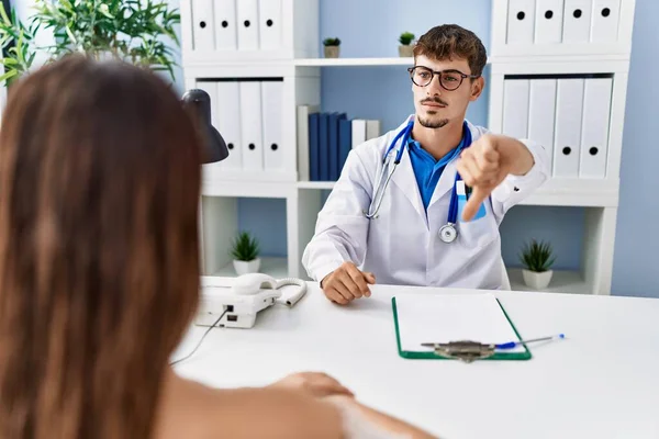 Young Doctor Client Medical Clinic Looking Unhappy Angry Showing Rejection — Stockfoto